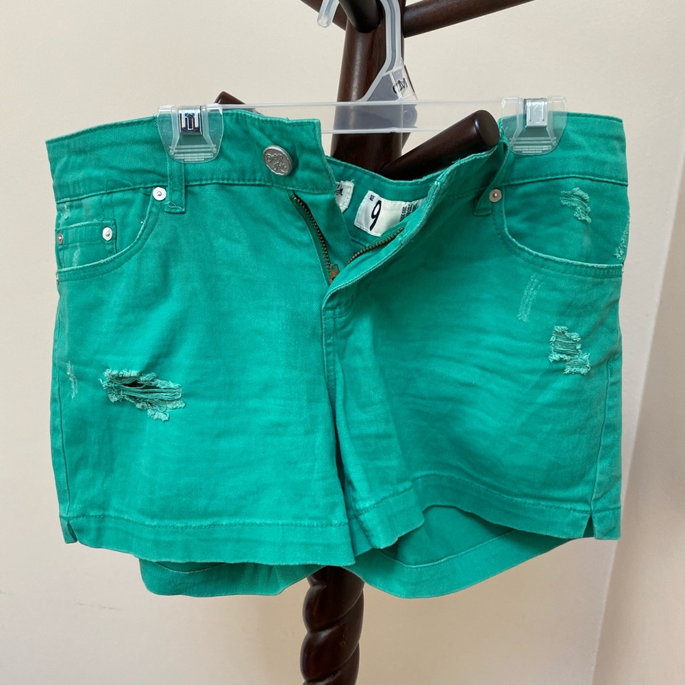 Junior’s green ripped short shorts!
